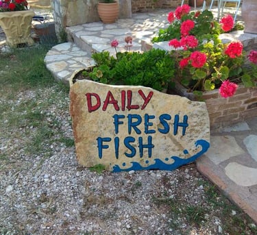 a sign that says daily fresh fish fish
