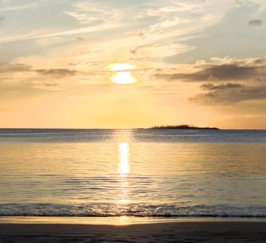 a boat is in the water at sunset