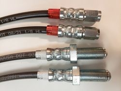 black stainless braided brake hoses with red jackets made by the custom brake parts experts at 260-426-3331