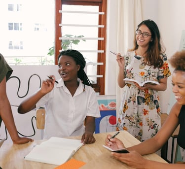 Group of multicultural women in a meeting setting strategic accountability goals