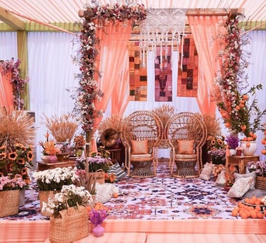 a wedding ceremony with a floral arrangement of flowers and flowers