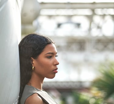 black girl posing in profile for a photo session