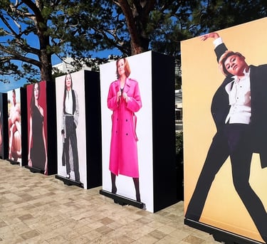 a row of posters of a man in a suit