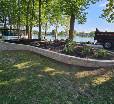 Custom retaning wall and landscaping along a lake