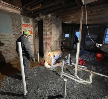 a man in a construction site with a helmet on