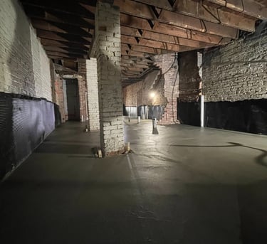 a skateboarder riding down a ramp in a warehouse