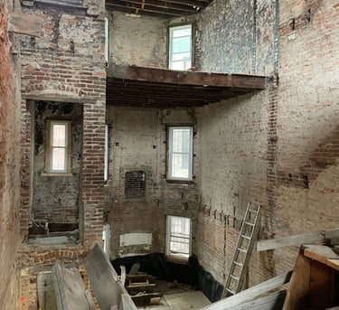 a room with a lot of wood and a ladder