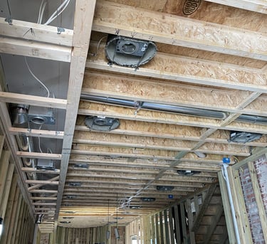 two men working on a construction project in a home