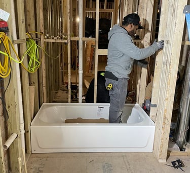 a man in a construction site with a tub tub