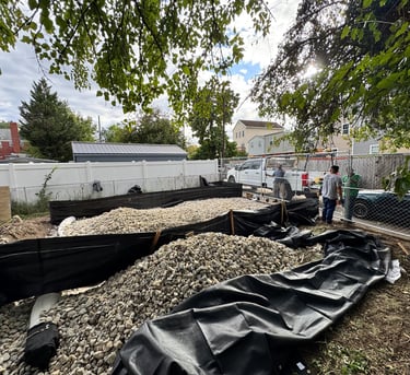 a man standing in front of a pile of gravel