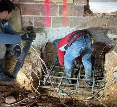 a man is working on a concrete floor