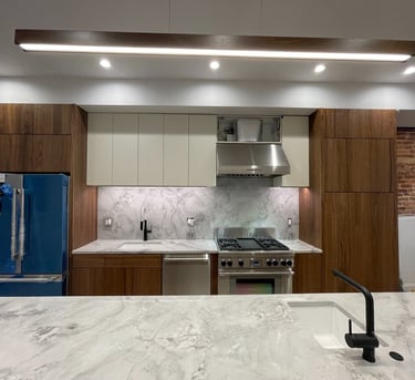 a kitchen with a marble counter top and a blue refrigerator