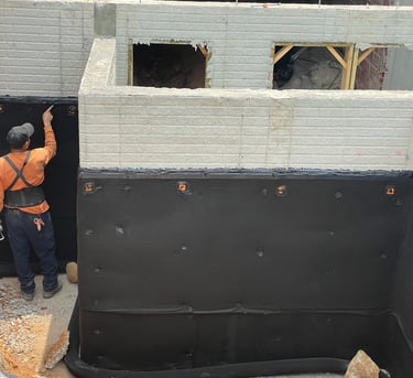a man in a construction site with a building being built