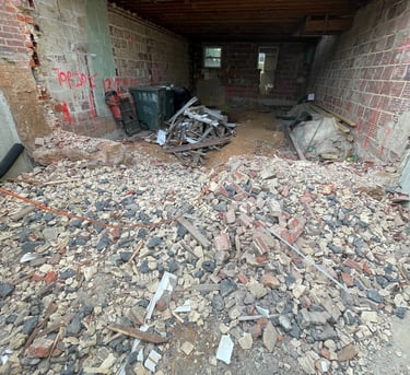 a pile of rubble in a building with a pile of rubble