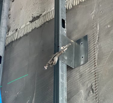 Light-gauge steel stud framing installation in a Washington DC commercial building interior