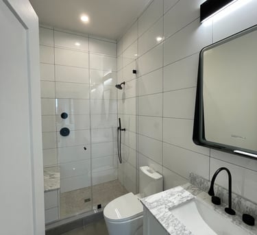 a bathroom with a toilet and a shower