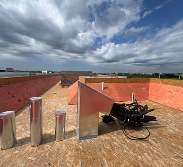 Rooftop framing carpentry with wind bracing for multi-unit residential construction in Washington DC by BBCDC general contrac