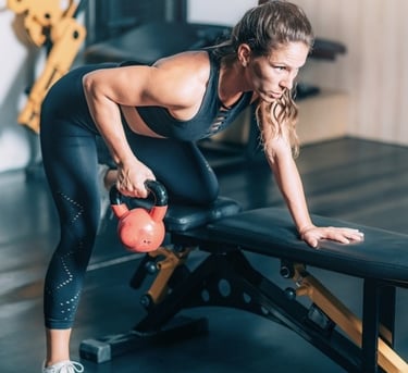 a woman using a kettlebell
