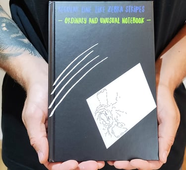 a man holding a book with a book cover
