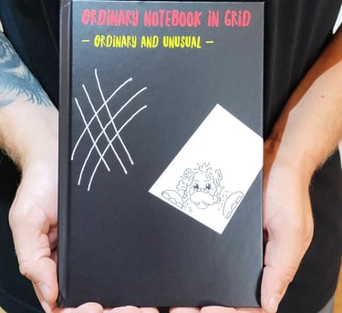 a man holding a book with a book cover