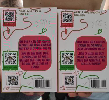 a person holding a book with qr code