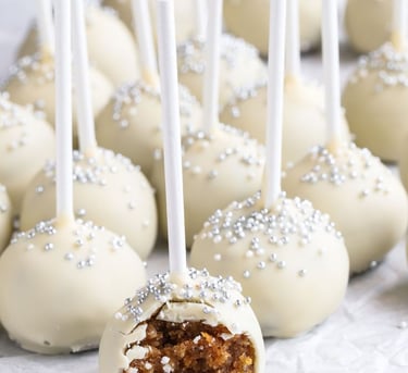 a bunch of cake pops on a table