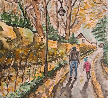 Father and daughter walking together in a park, surrounded by soft yellow-orange autumn leaves.