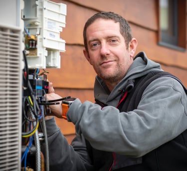 Engineer installing a heat pump