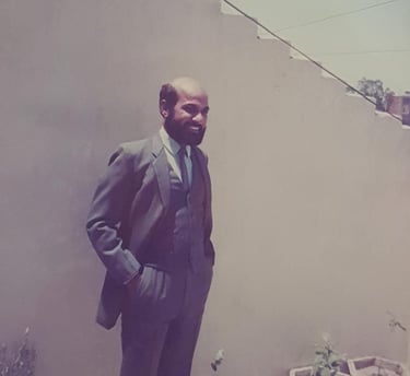Ravinder Vashisht surrounded by potted plants