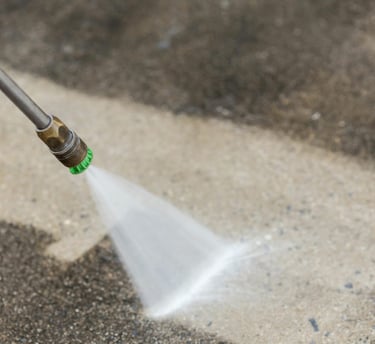 Power washing driveway and sidewalk