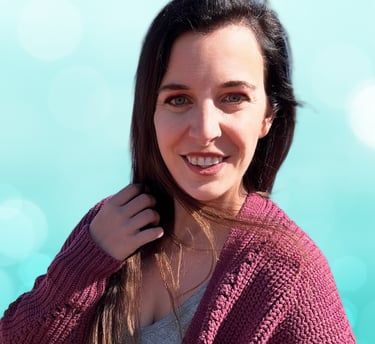 a woman in a purple sweater and a blue sky