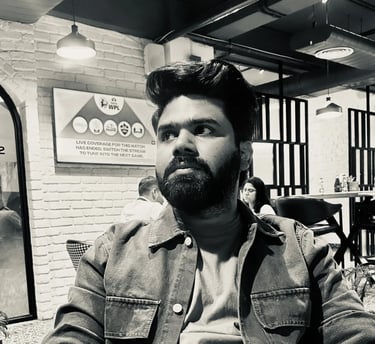 a man with a beard and a beard sitting at a table