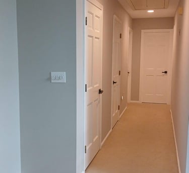 Interior hallway remodeling with new doors and paint by Renjay Remodeling, CT