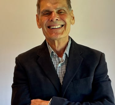a man in a suit and tie smiling