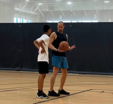 Basketball Coach Igor working with young player