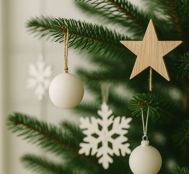 Scandinavian-style Christmas tree ornaments in white and wood with paper stars and clean minimalist