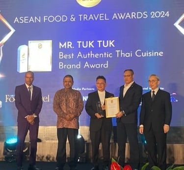 Mr Tuk Tuk receiving the Best Authentic Thai Cuisine Brand Award