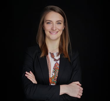 a woman in a suit and a black jacket