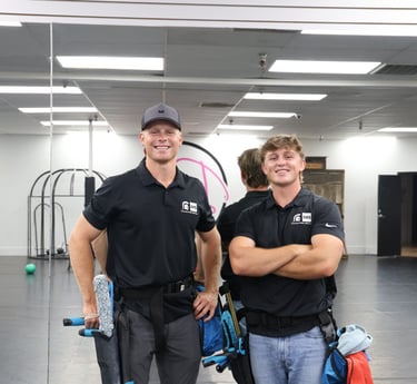 kyler and luke smiling at the camera, owners of Spartan