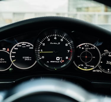 an Enlab Porsche 911 Turbo S dashboard with a dashboard with a clock and a clock