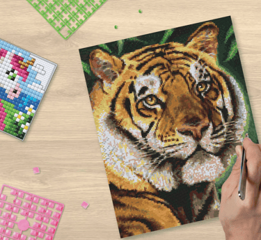 A small picture of colorful unicorn and big picture of colorful tiger made using pixel squares