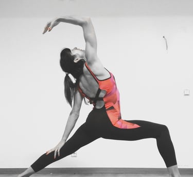 a woman in a sports bra top doing yoga