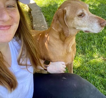 girl with a dog next to her