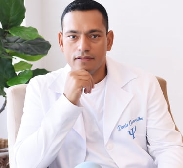 a man in a white lab coat sitting on a chair