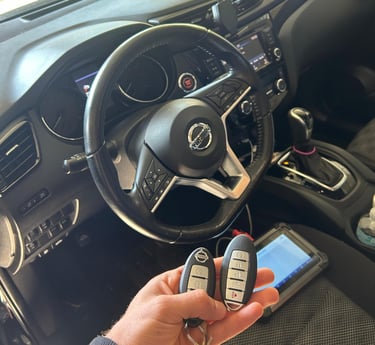 locksmith programming a car key fob on-site for a modern vehicle in Flagler County