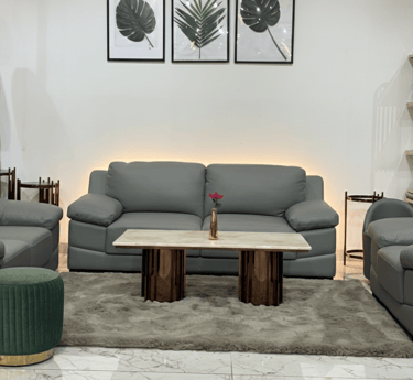 Modern grey sofa set with center table at furniture showroom in Bengaluru
