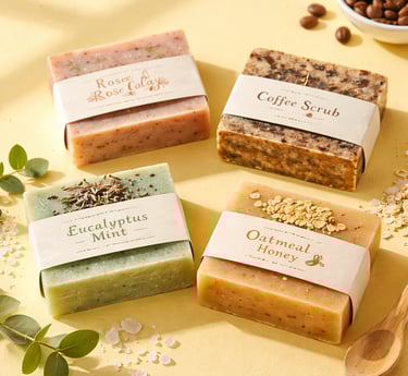 Flat lay of handmade soap bars wrapped with printed paper belly bands. 