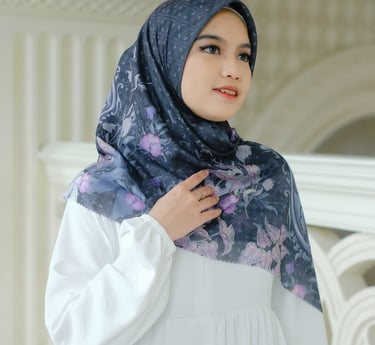 a woman wearing a hijab in a white dress