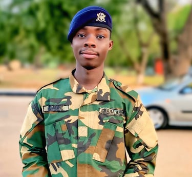 a man in a military uniform standing in front of a car