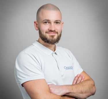 a man with a bald haircut and bearding